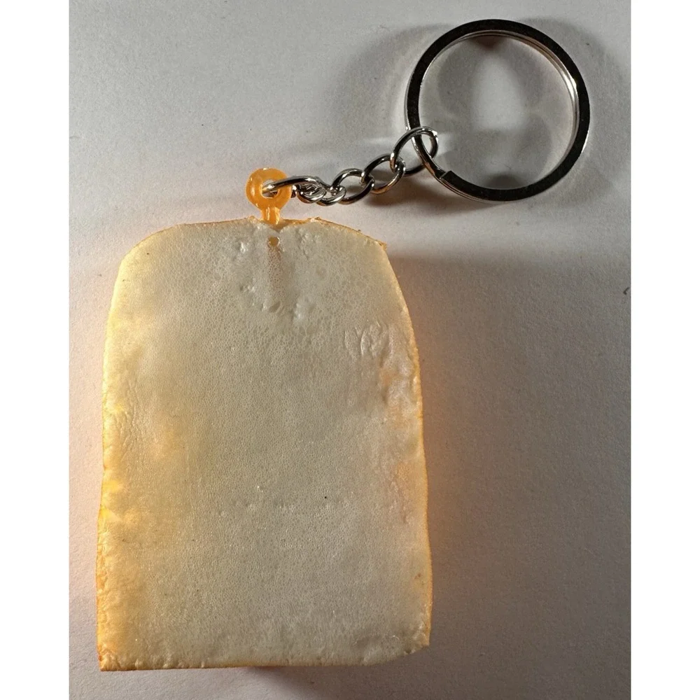 Cute Slice of toast keychain featuring playful smug facial expression